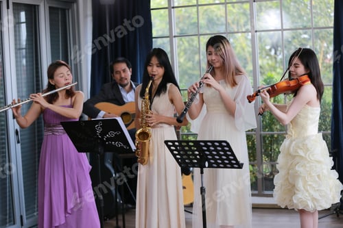Preview: Women musical band playing instruments in background. Online home studio plays and sing a song.