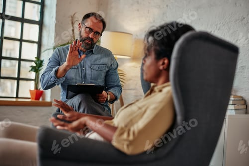 Preview: Caring counselor listening to female patient