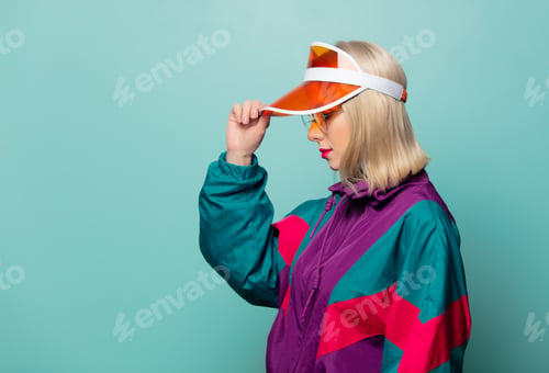 Preview: Style blonde woman in 80s glasses and hat