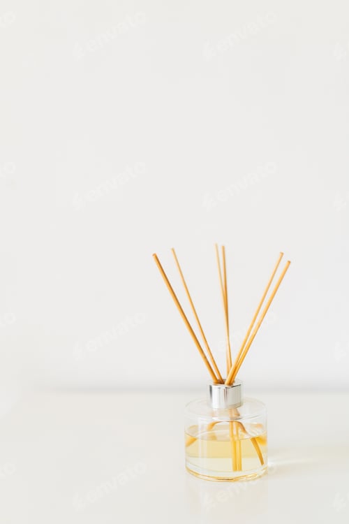 Preview: Aromatherapy. Diffuser bottle on a white background. Incense sticks for the home