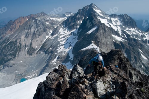 Preview: Female climber on mountain summit, Redoubt Whatcom Traverse, North Cascades National Park, WA, USA