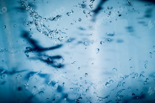 Preview: Blue Water Splash On Blue Background For Abstract Water Concept