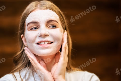 Preview: Young woman making a face mask