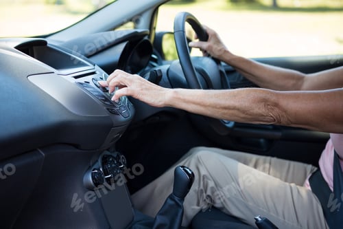 Preview: Senior woman driving a car