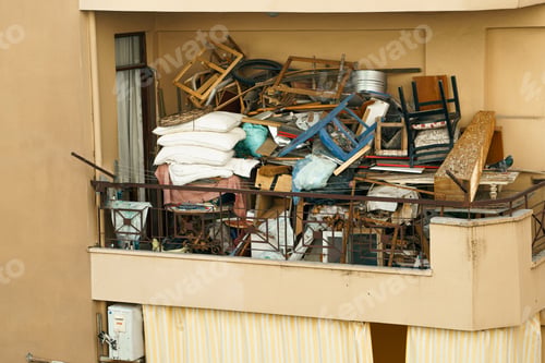 Preview: Ugly, terrible balcony disorder. Multi-storey building full of garbage, old furniture, unnecessary
