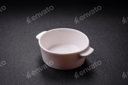 Preview: Beautiful empty white ceramic gravy boat on a textured concrete background