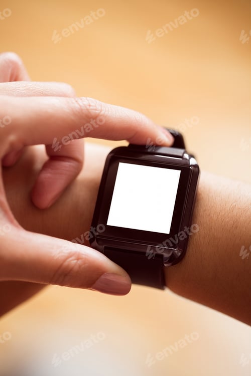 Preview: Asian woman using smart watch with copy space at home in the living room