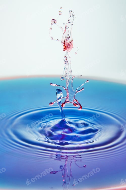 Preview: Abstract background of splash of color water, collision of colored drops