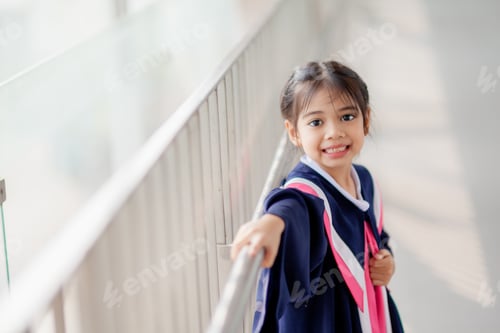 Preview: Happy Asian girls in graduation gowns on their graduation day at school.Graduation concept