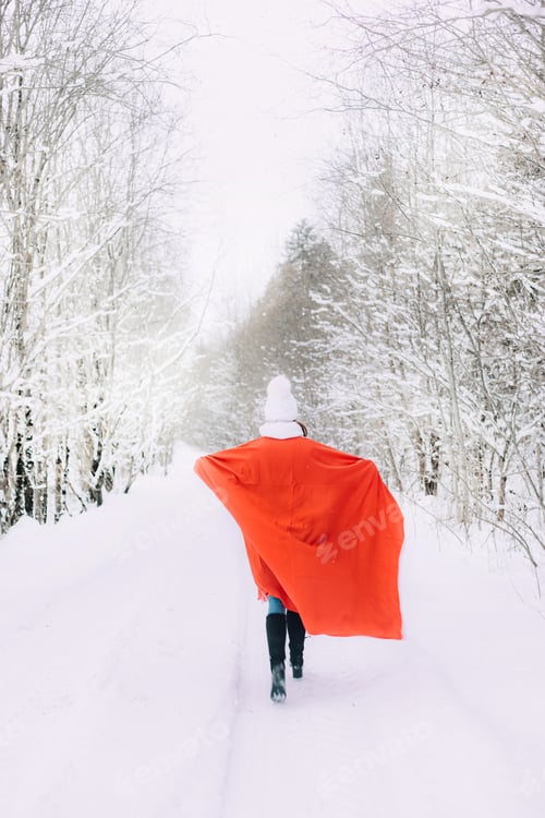 Preview: A girl with a plaid runs in winter