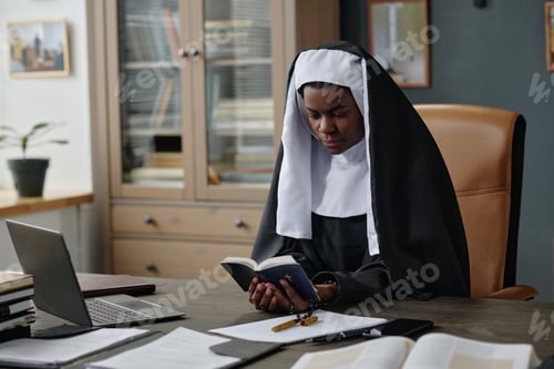 Preview: Nun in Black Habit Reading Bible