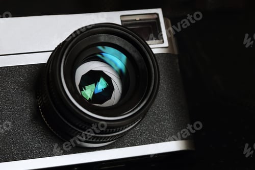 Preview: Close up vintage camera over dark background,Close up retro camera lens