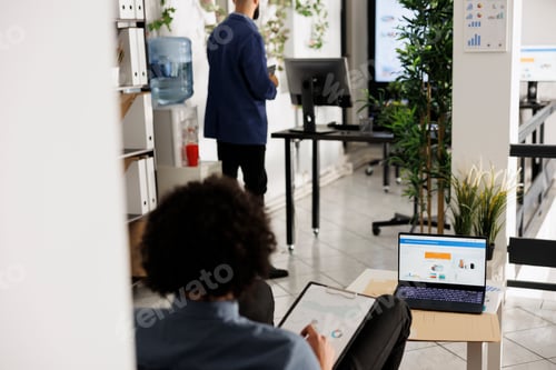 Preview: Entrepreneur preparing financial report, analyzing profit on laptop screen