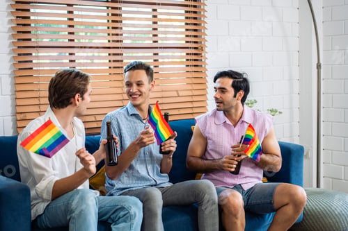 Preview: Caucasian handsome man gay family holding LGBTQ flag and dance together.