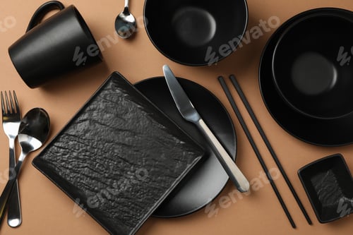 Preview: Tableware and cutlery on craft background, top view