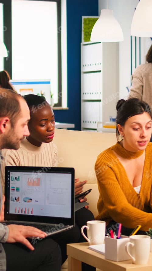 Preview: Businesswoman corporate leader talking to diverse team explaining project plan