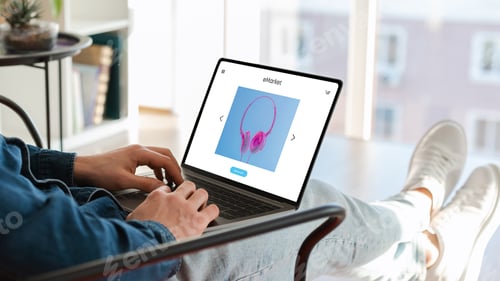 Preview: Man using pc laptop with hardware store on screen, sitting on puff chair with computer, order new