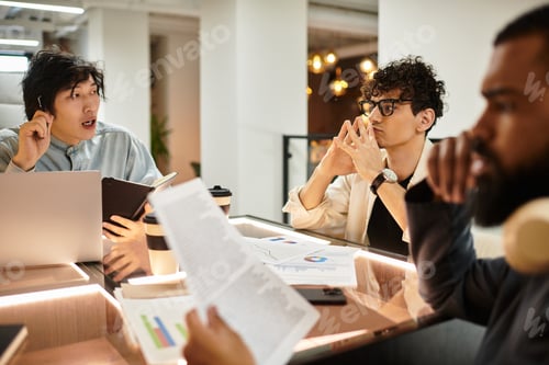 Preview: Collaboration and brainstorming in a modern office space during a work meeting