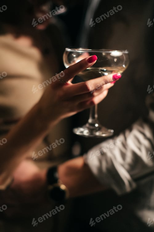 Preview: Romantic dinner. Couple cheers with white wine