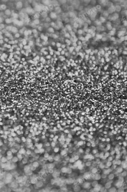 Preview: Silver decorative sequins. Background image with shiny bokeh lights from small elements