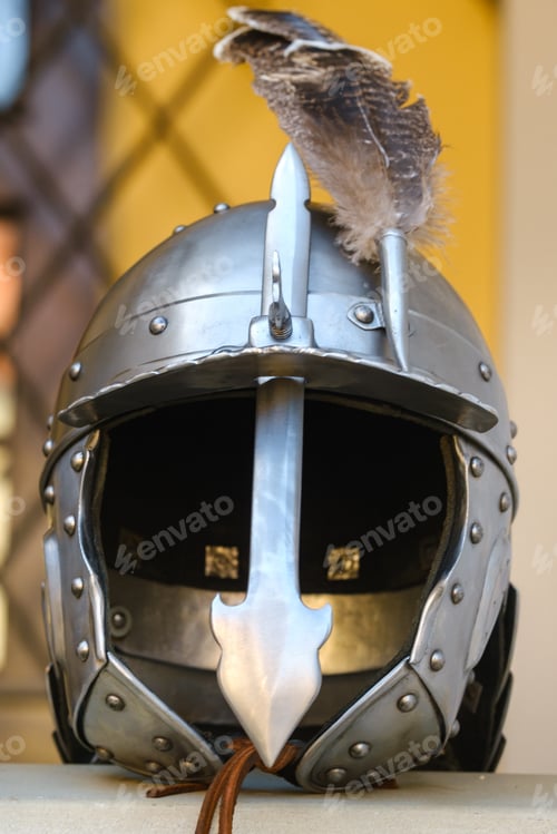 Preview: An ancient knight's helmet with a feather .Medieval concept