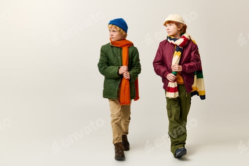 Preview: Stylish children enjoying carefree moments of friendship during a playful day in winter