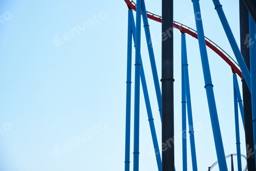 Preview: Industrial background of large vertical metal pipes against the blue sky.