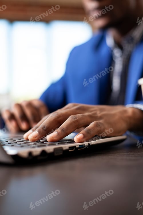 Preview: Employee typing at startup office desk