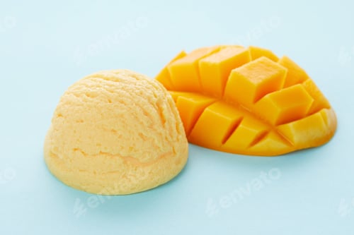 Preview: Selective focus shot of delicious ice cream scoop with mango isolated on a blue background