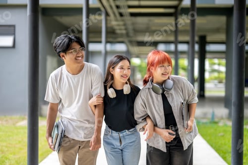 Preview: Three young people are walking down a hallway, one of them wearing headphones
