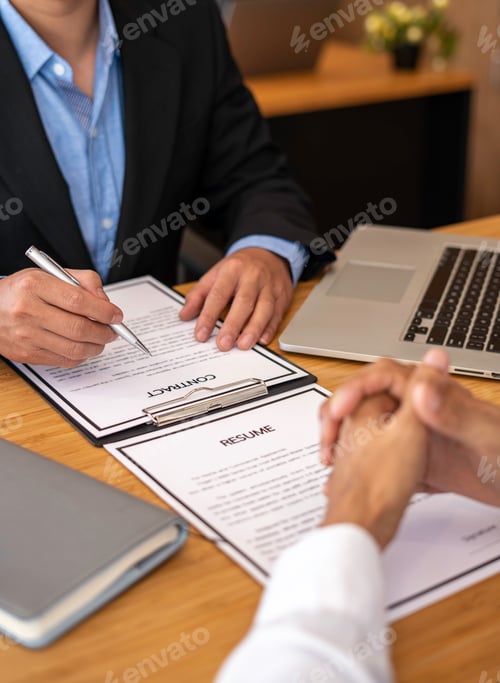 Preview: Human resources manager conducting job interview with applicant in the office, Candidate with resume