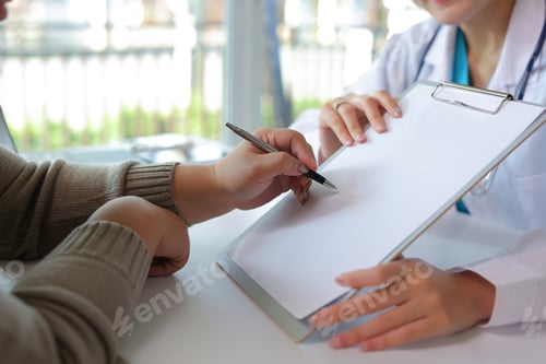 Preview: Patient signing medical form for consent in healthcare