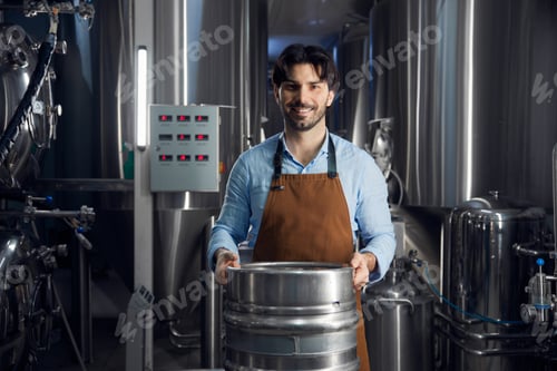 Preview: Brewer man is diligently carrying a large metal barrel