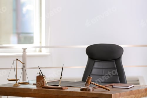 Preview: Table with scales of justice and judge gavel in lawyer's office