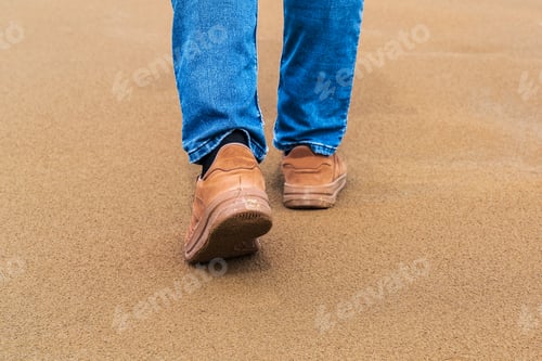 Preview: A man walks on the sand