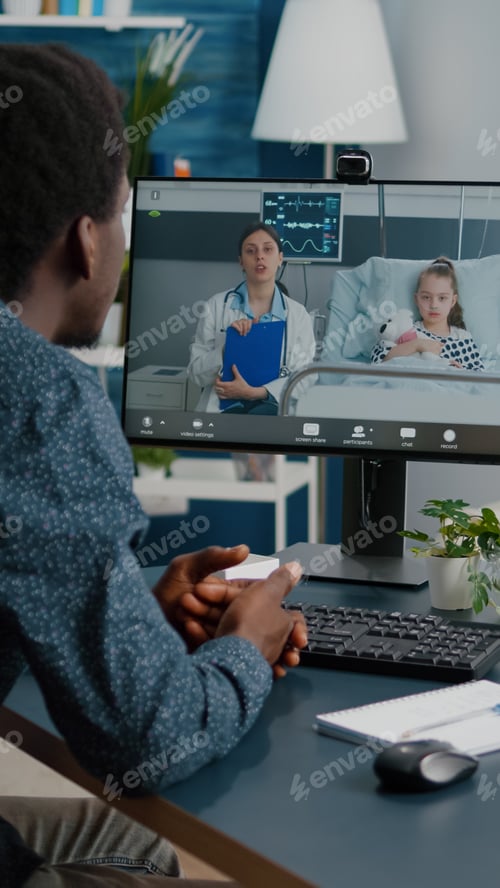 Preview: Worried dad for her little girl in hospital ward, talking on video conference call