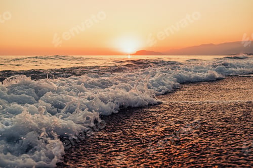 Preview: Scenic orange sunset on the beach