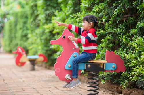 Preview: Active little girl on playground