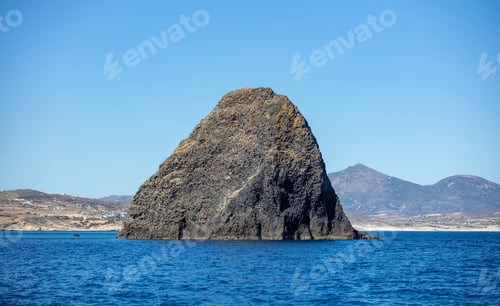 Preview: Kimolos island, Cyclades Greece. Huge rock blue turquoise sea clear sky landscape background.