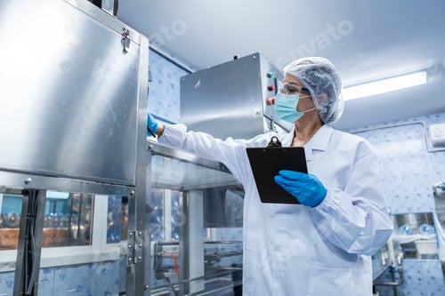 Preview: Female worker using tablet checking quality drinking water before process of filling water
