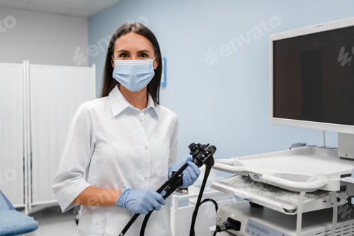 Preview: Female doctor gastroenterologist with probe to perform gastroscopy and colonoscope