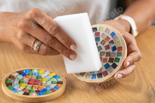 Preview: Making coasters at home, applying a final protective coat to coaster's surface during craft work