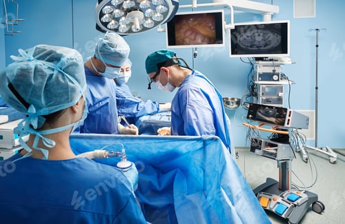 Preview: Surgeons working on patient in modern operating room of hospital. Teamwork in surgical department