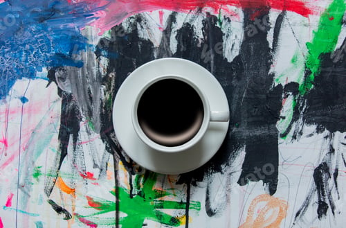 Preview: Cup of coffee in a center of art paint.