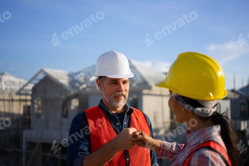 Preview: Blue collar workers are building house.