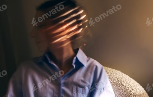 Preview: portrait of a young woman in casual clothes taken at long exposure