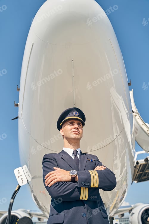 Preview: Handsome serene pilot looking into the distance