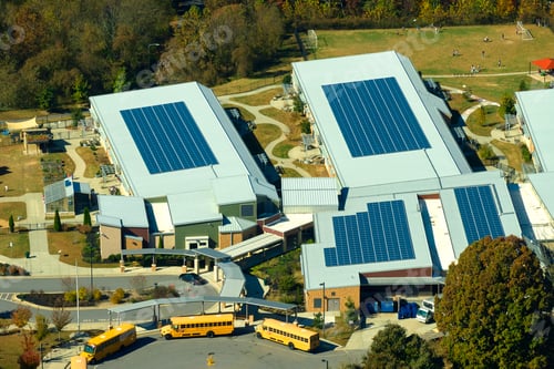 Preview: Roof of american school building covered with photovoltaic solar panels