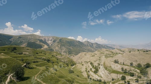 Preview: Aerial view of amazing landscape with beautiful valley on a sunny day. Action. Flying above summer
