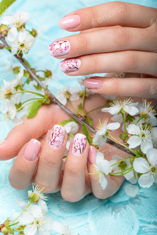 Preview: Spring manicure for the bride in gentle tones with flowers. Nail Design. Close-up.